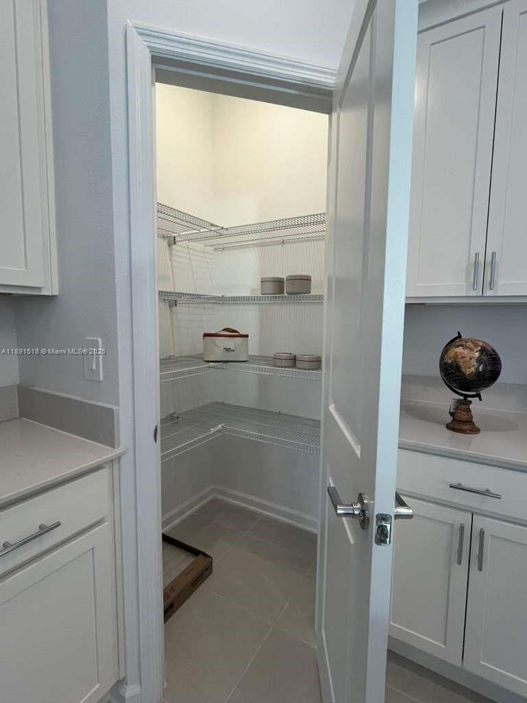 5984 Zen Way, Unit 5984 Clermont, FL 34714 - Photo 35 of 51 a view of walk in closet with empty racks