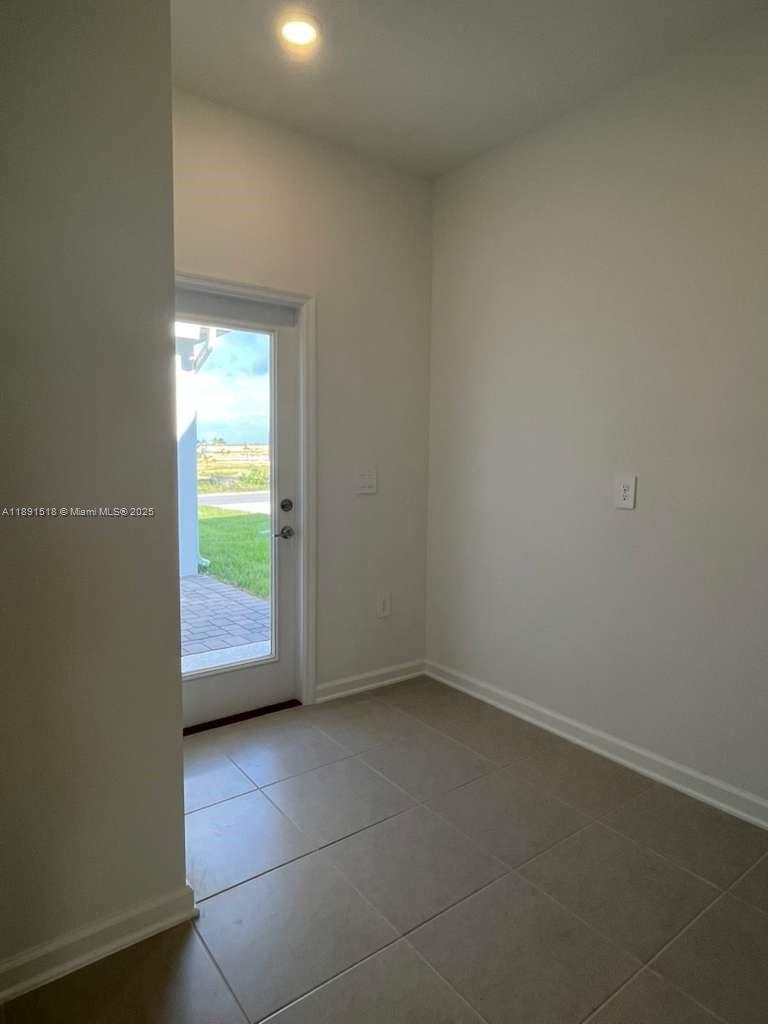 5984 Zen Way, Unit 5984 Clermont, FL 34714 - Photo 45 of 51 a view of an empty room and a window