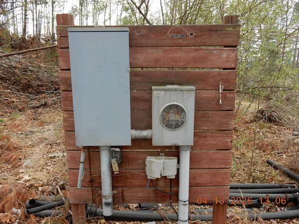a brick building with a clock on the wall