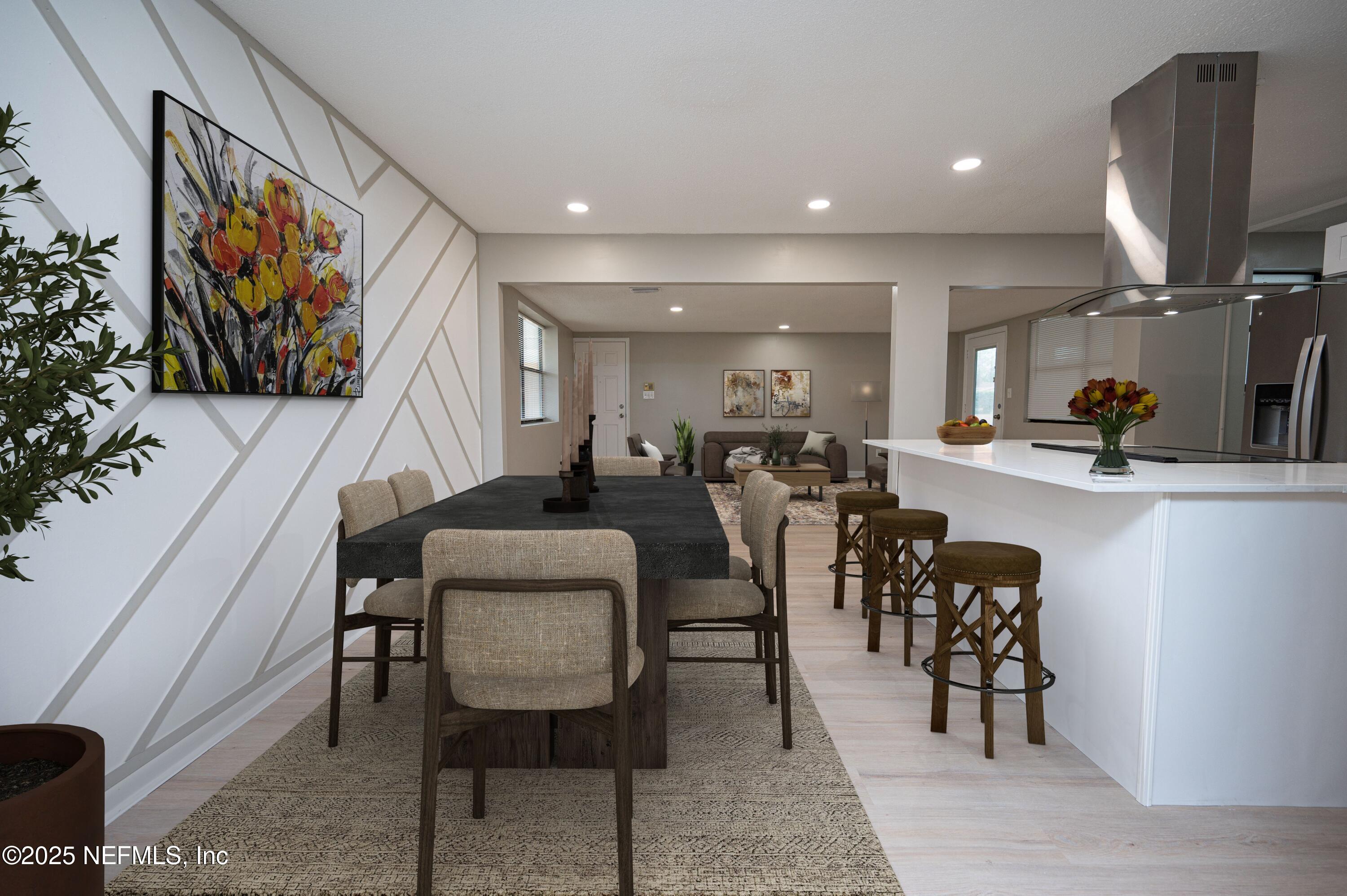 1195 Pecan Cove Jacksonville, FL 32221 - Photo 18 of 54 a dining room with furniture and a flat screen tv