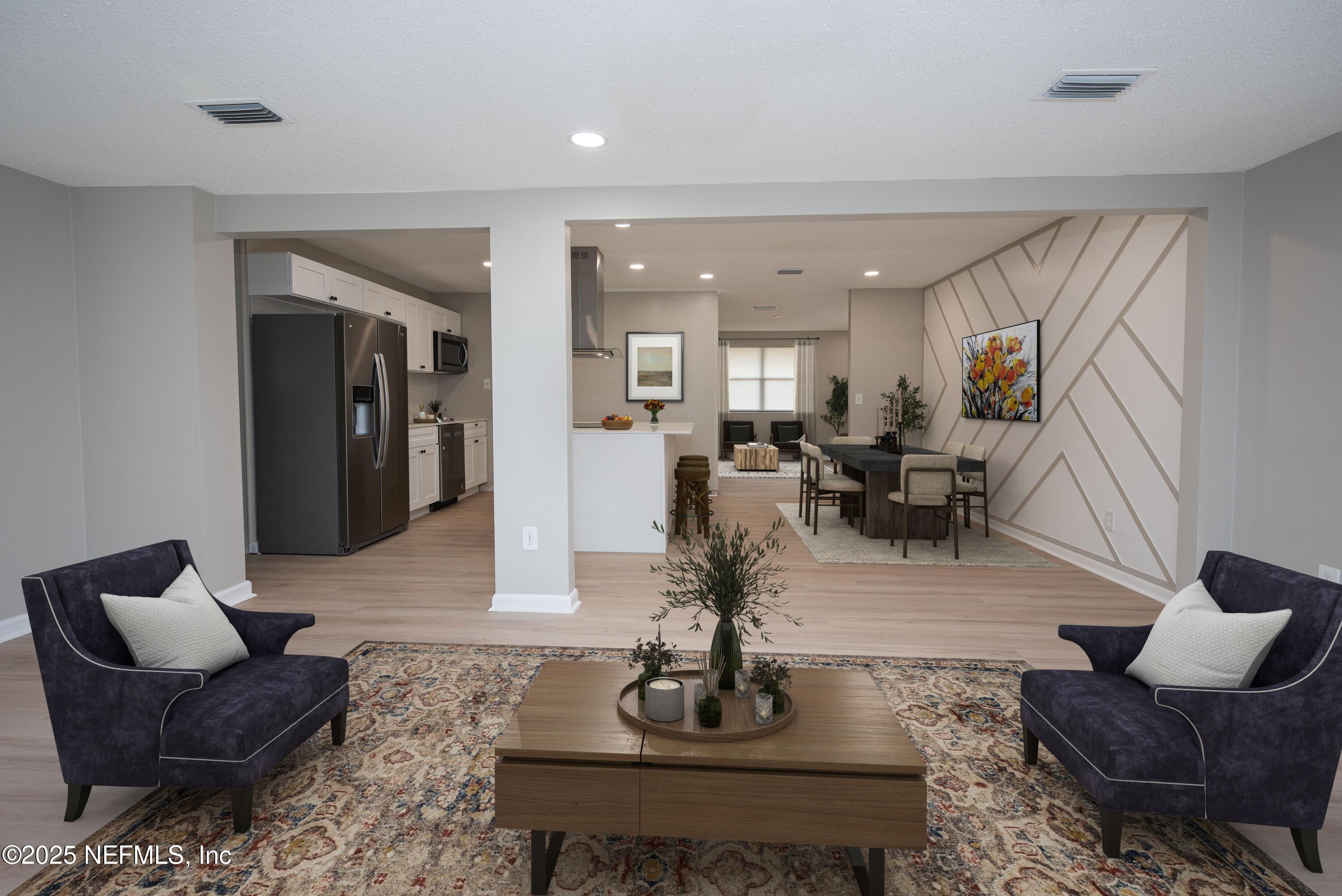1195 Pecan Cove Jacksonville, FL 32221 - Photo 23 of 54 a living room with furniture and wooden floor
