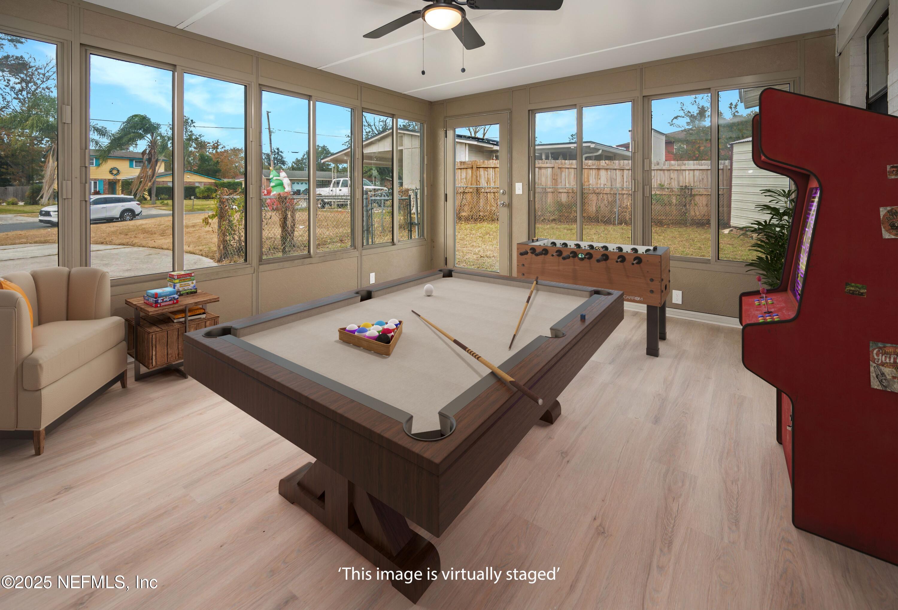 1195 Pecan Cove Jacksonville, FL 32221 - Photo 35 of 54 a living room with furniture and a large window