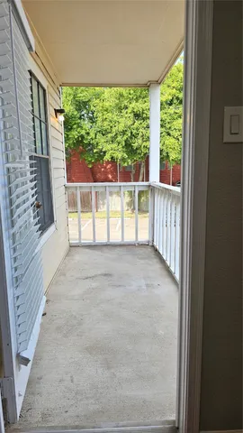 a view of empty room with floor to ceiling window