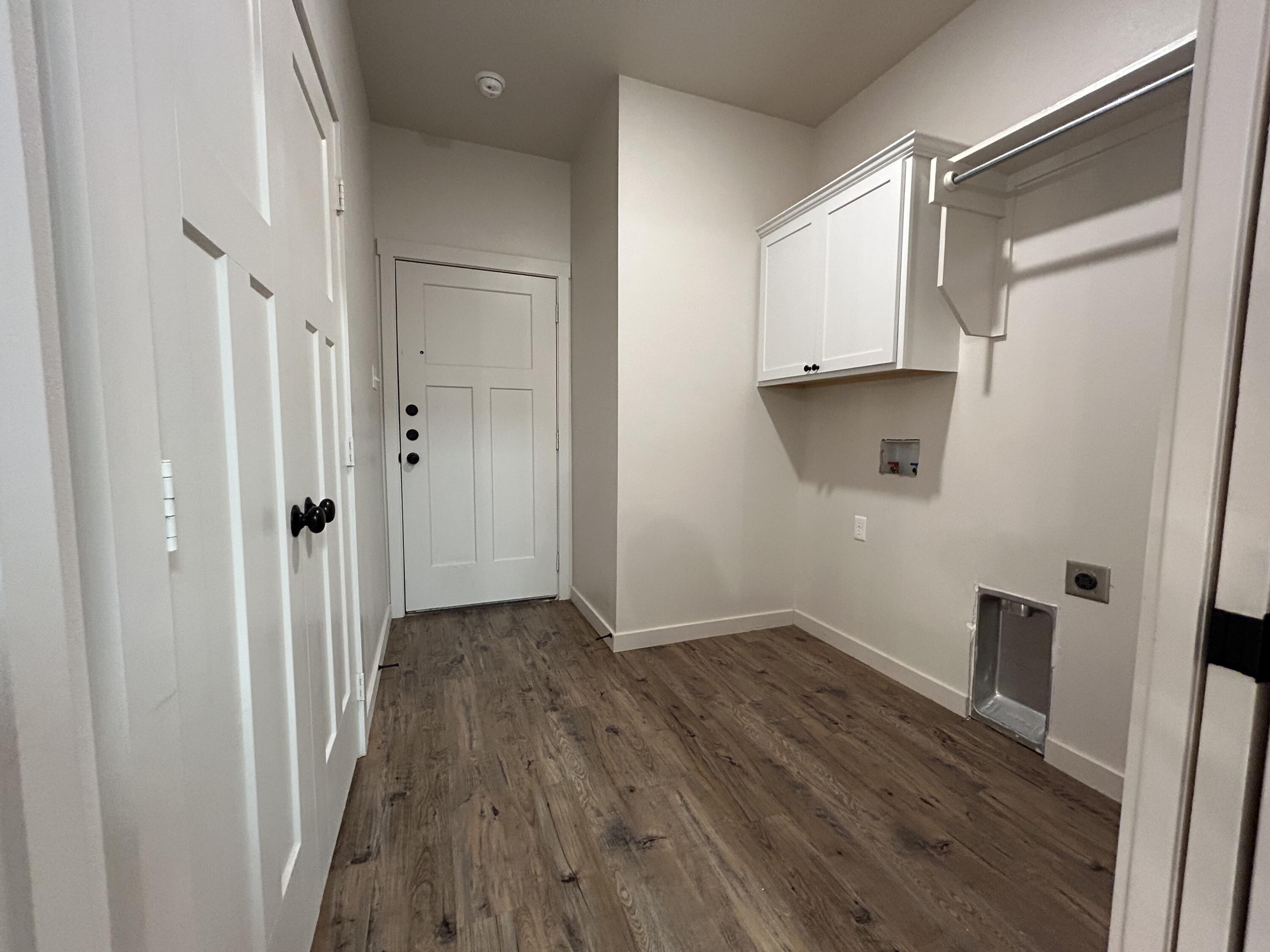 2547 138th Street Lubbock, TX 79423 - Photo 5 of 11 a view of hallway with wooden floor and stairs