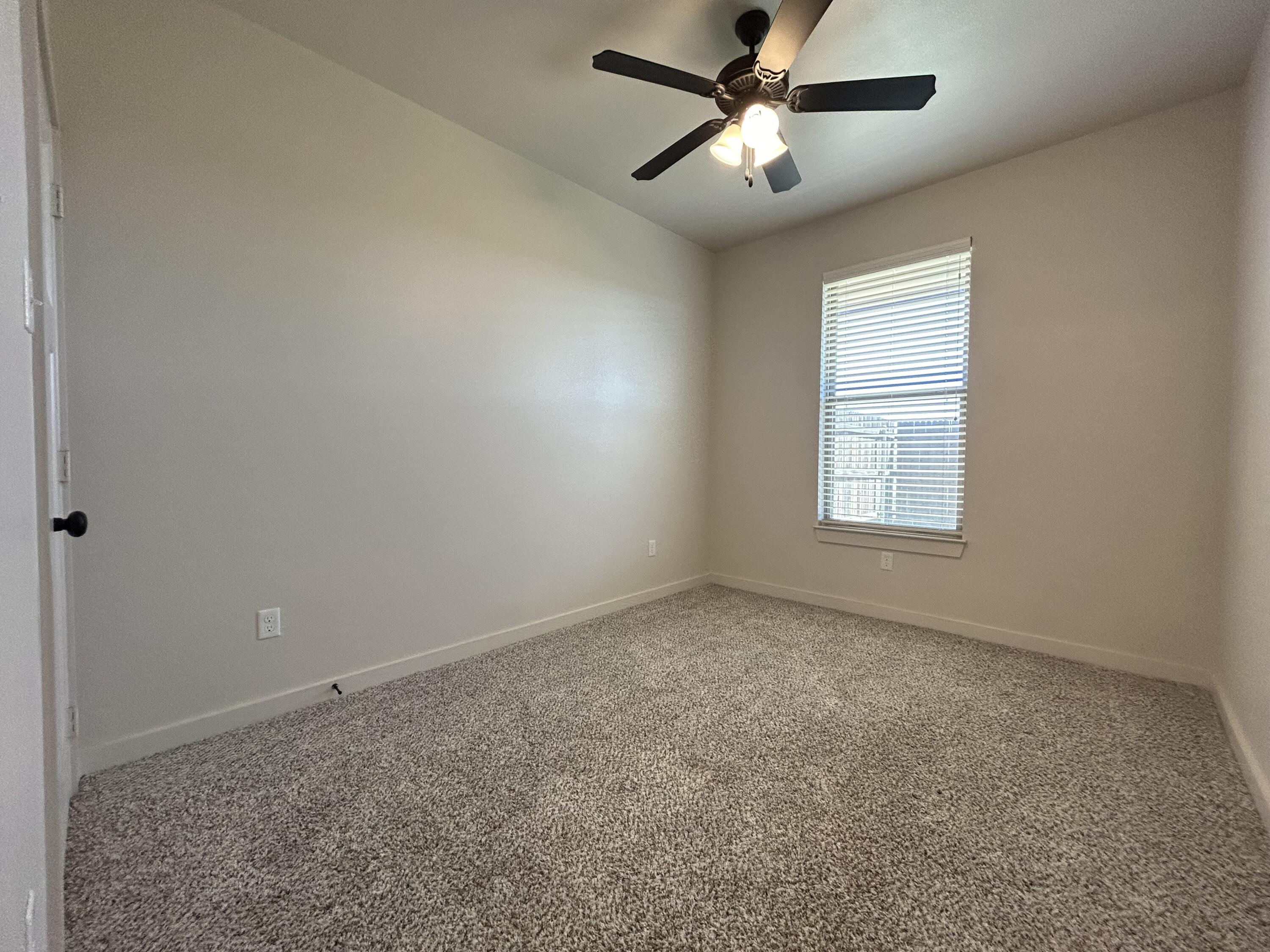 2547 138th Street Lubbock, TX 79423 - Photo 9 of 11 a view of empty room with ceiling fan