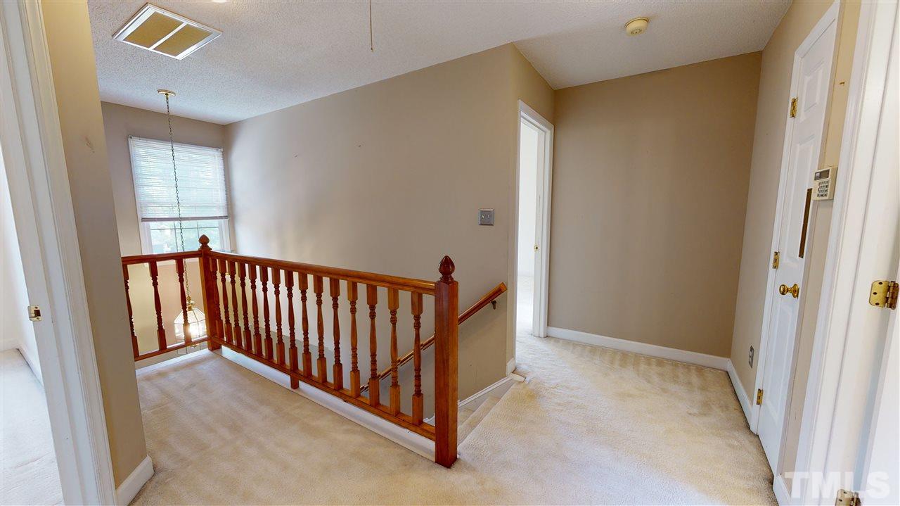 4232 Birmingham Way Raleigh, NC 27604 - Photo 18 of 30 a view of a hallway to a bedroom