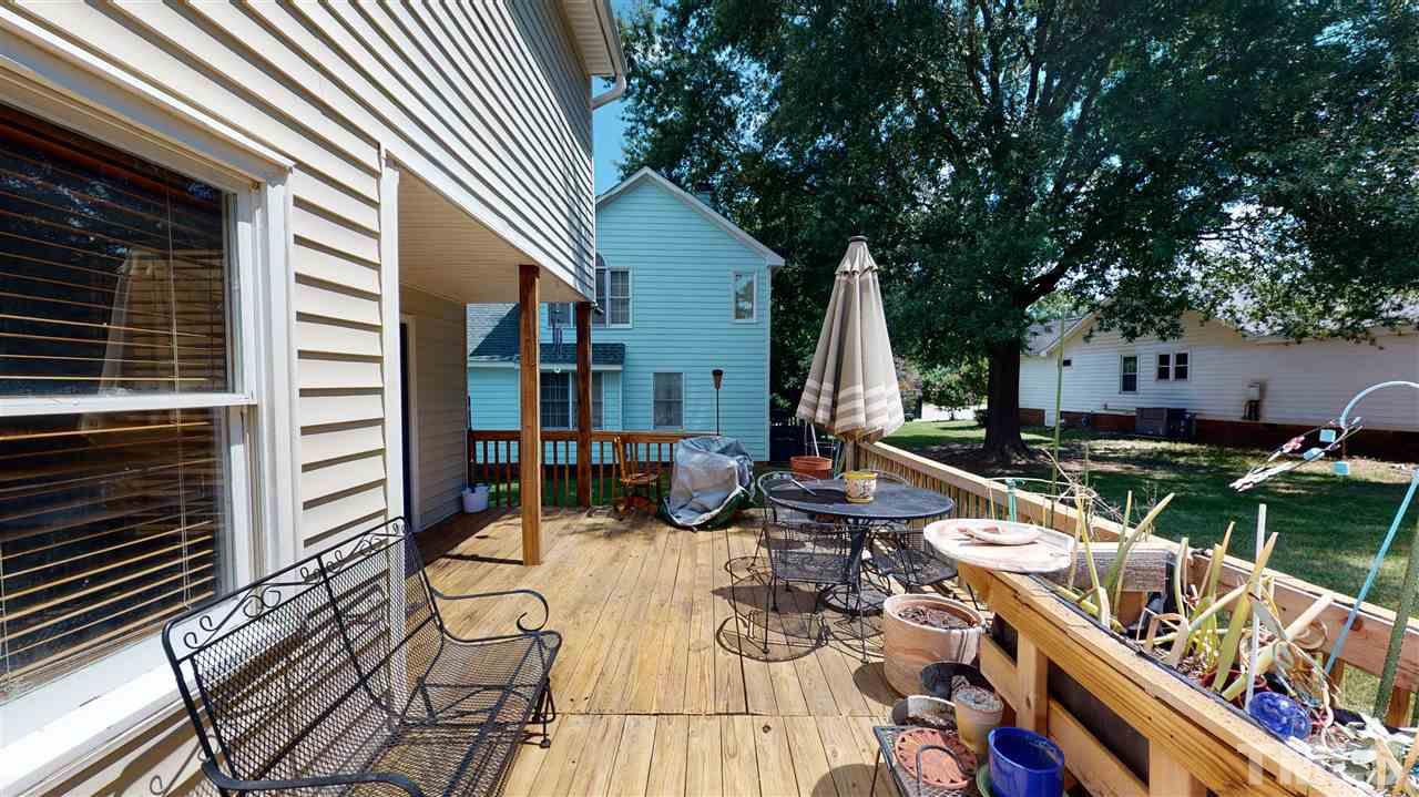 4232 Birmingham Way Raleigh, NC 27604 - Photo 27 of 30 a view of a patio with couches table and chairs and potted plants