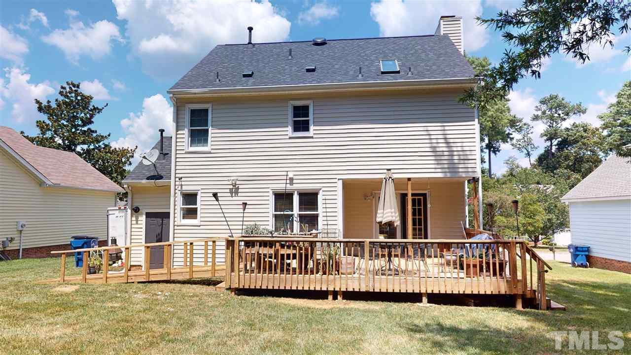 4232 Birmingham Way Raleigh, NC 27604 - Photo 28 of 30 a view of a house with wooden deck and a yard