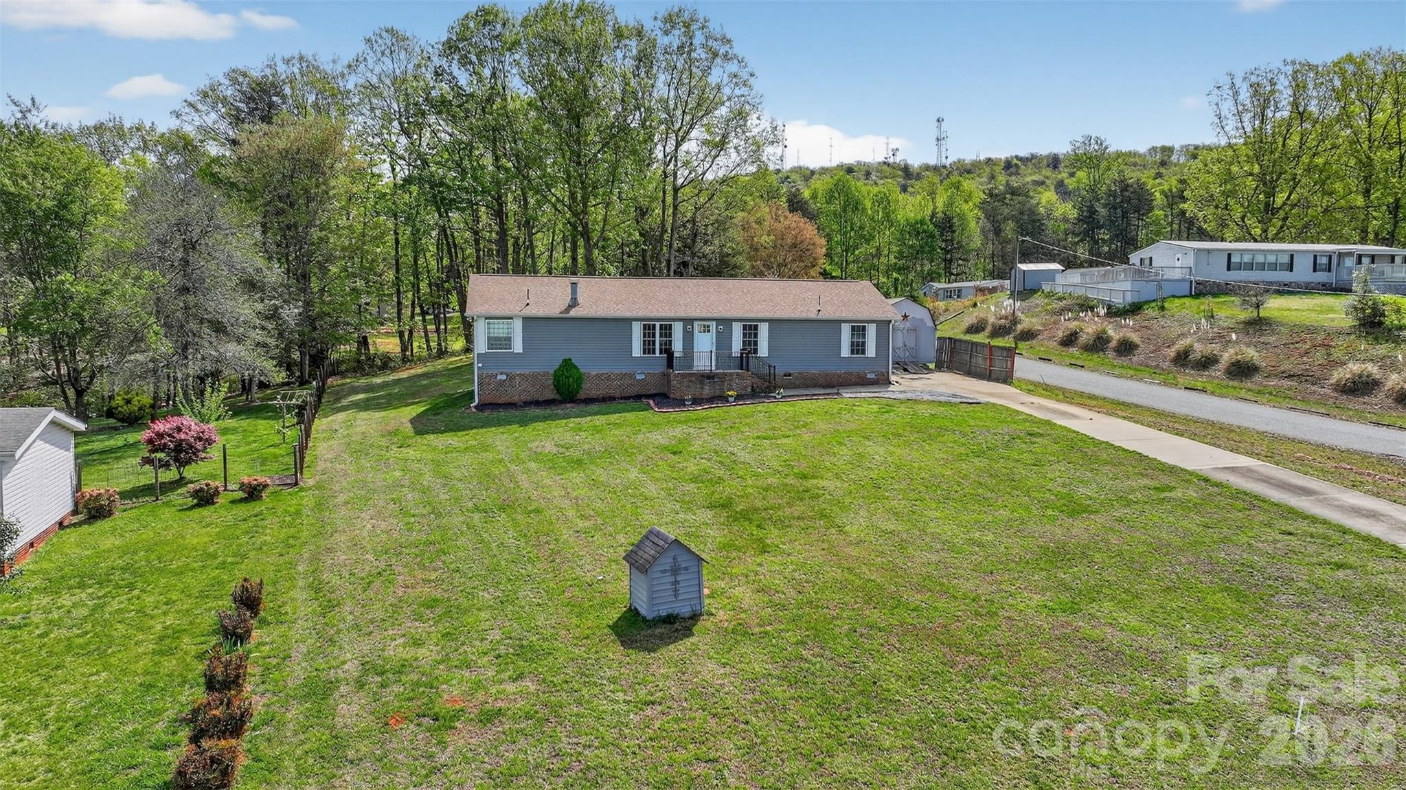 4352 Anderson Mountain Road Maiden, NC 28650 - Photo 34 of 42 a view of a house with a yard and sitting area