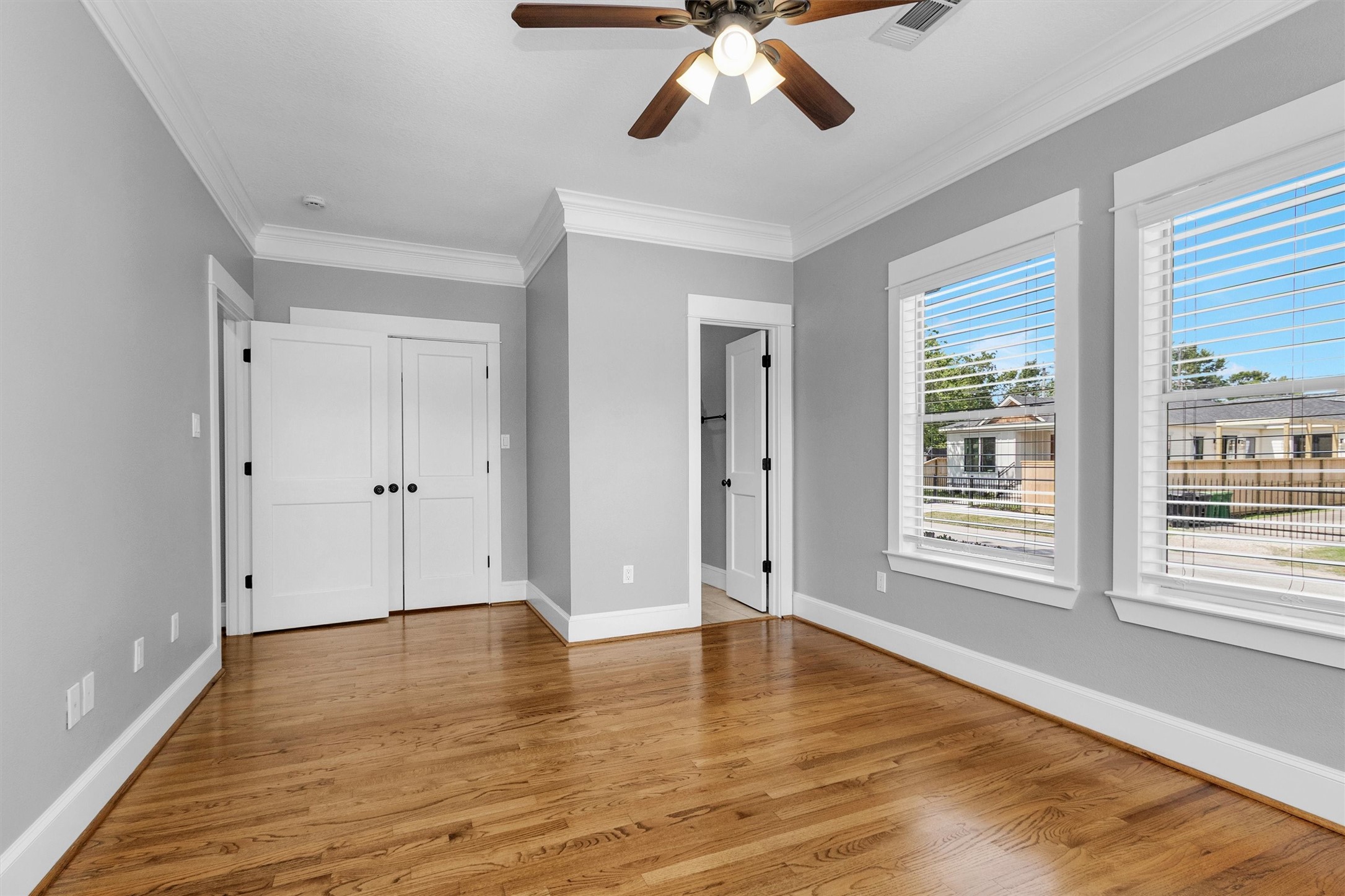 304 Vincent Street Houston, TX 77009 - Photo 17 of 36 a view of an empty room with wooden floor and window