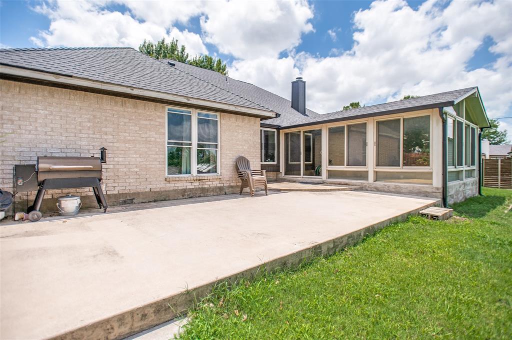 5643 West Caylor Road Fort Worth, TX 76244 - Photo 30 of 37 Expansive concrete patio area with a sunroom addition and a partial grassy yard