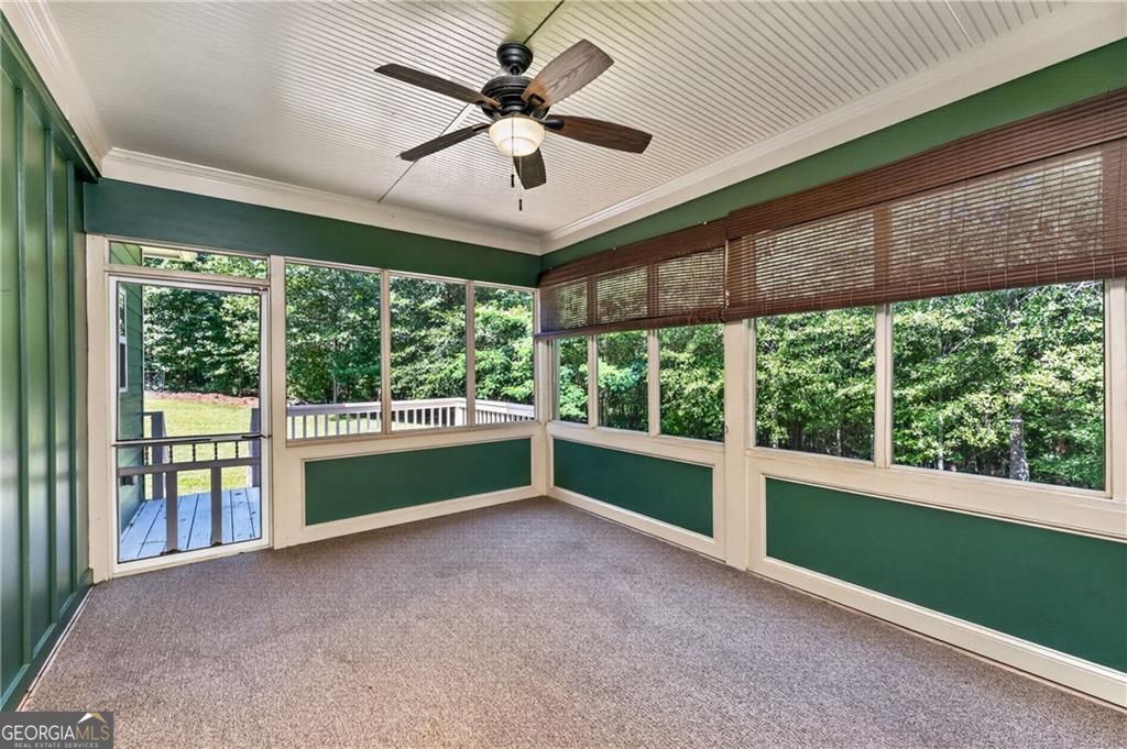 1158 Bailey Road Aragon, GA 30104 - Photo 42 of 73 a view of an empty room with a window and a ceiling fan