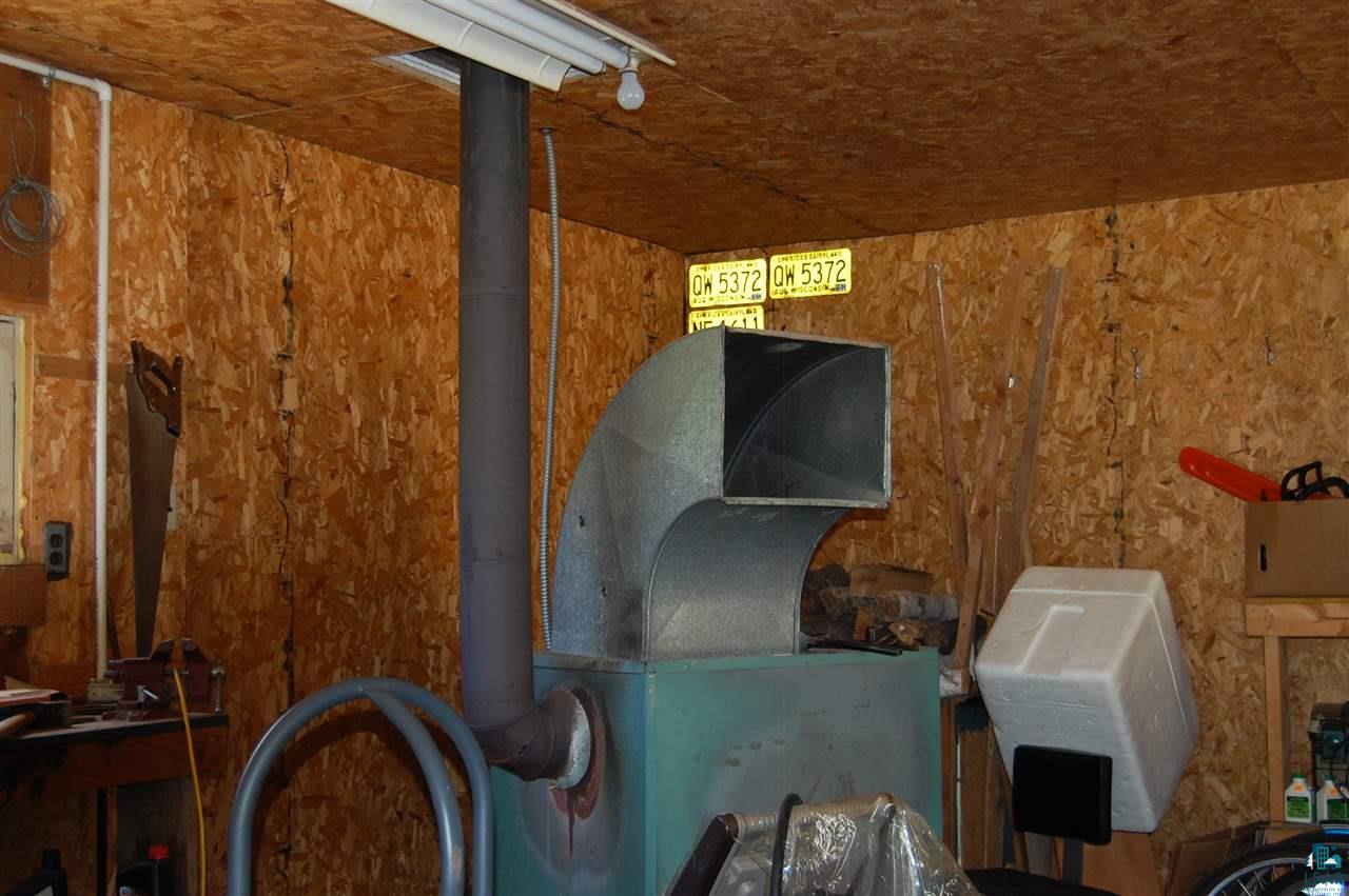 118 East Harney Road Esko, MN 55733 - Photo 21 of 24 Wood furnace in garage