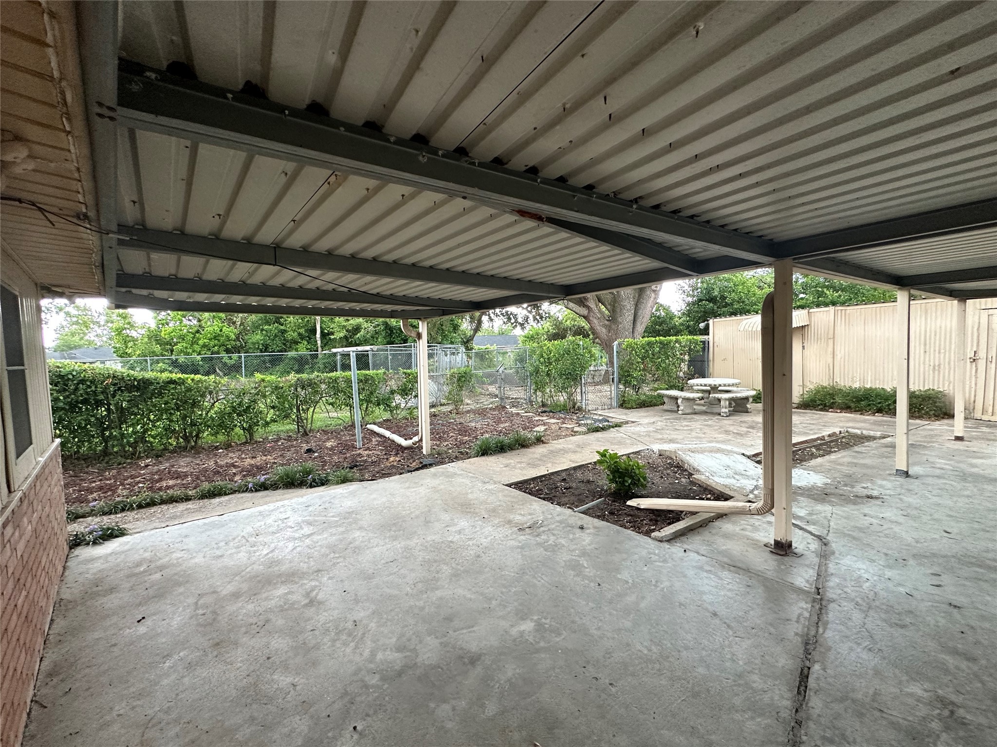 4101 Philco Drive Houston, TX 77080 - Photo 13 of 23 a view of a backyard with floor to ceiling window and wooden fence