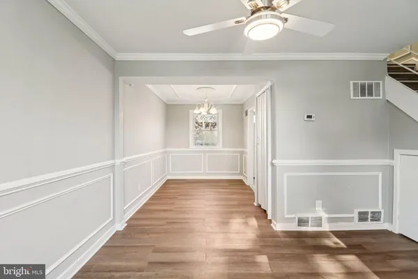 a view of an entryway with wooden floor