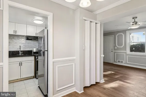 a kitchen with appliances cabinets and a sink