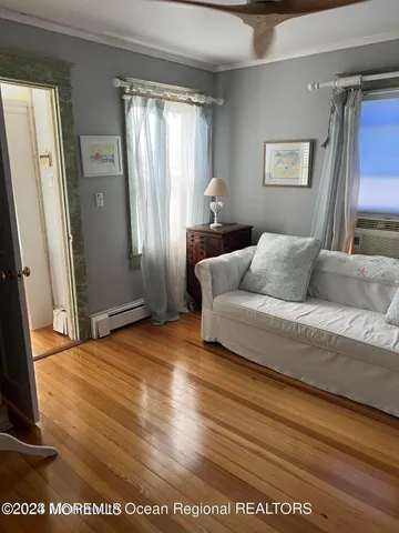 a bedroom with a bed a mirror and a desk