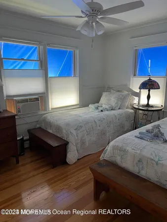 a living room with furniture and a lamp