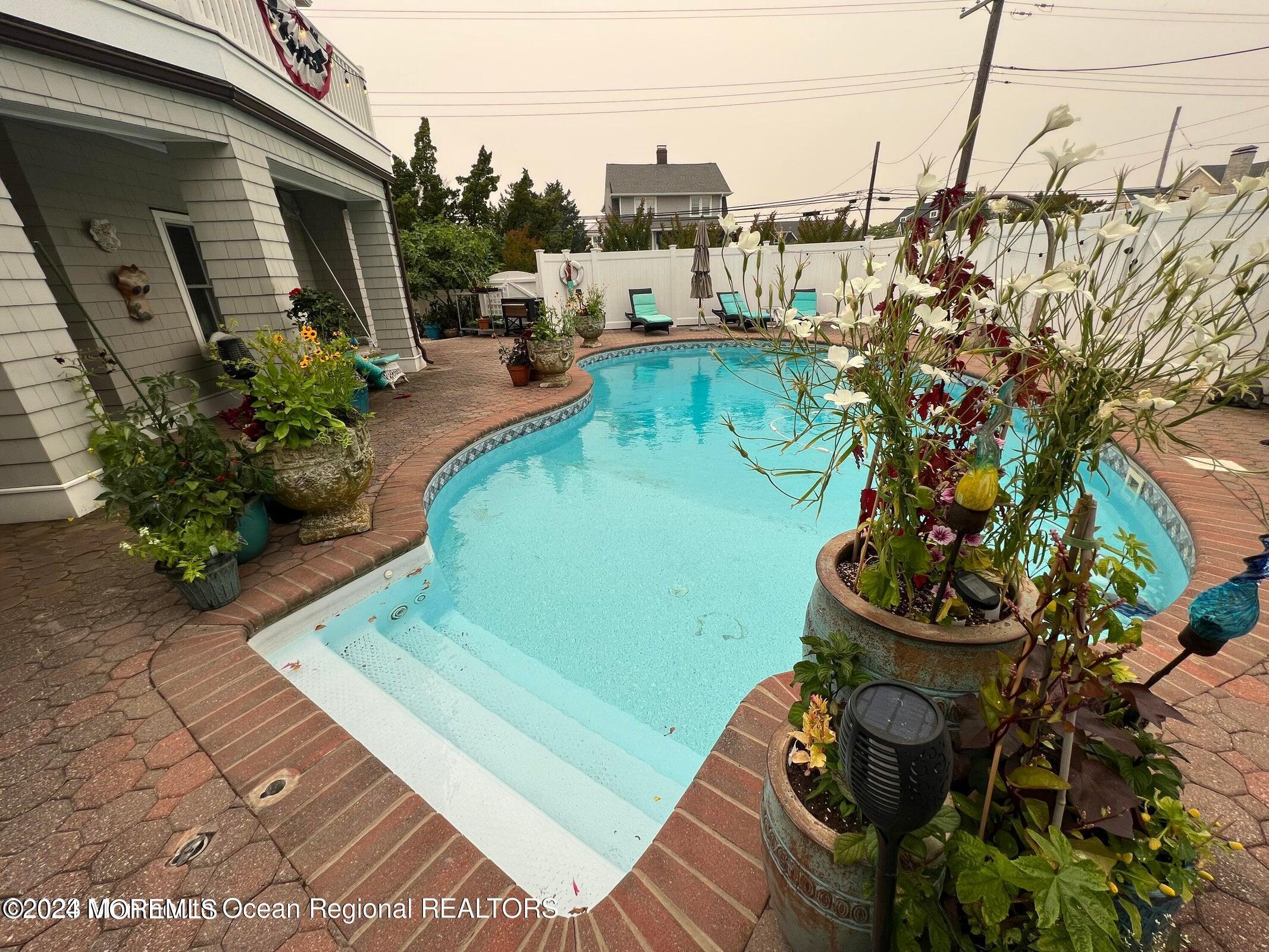 106 Mathis Place, Unit PO243 Mantoloking, NJ 08738 - Photo 5 of 25 a view of a backyard with sitting area
