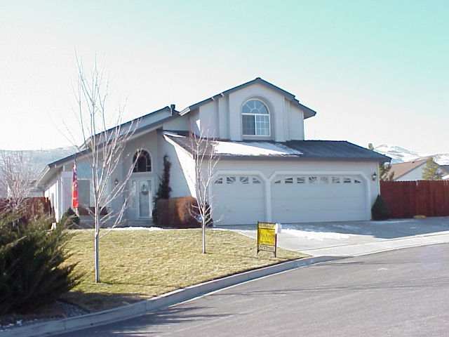 1940 Campfire Place Reno, NV 89511 - Photo 1 of 1 a view of a house with a wooden fence
