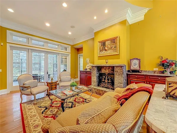 a kitchen with stainless steel appliances granite countertop a sink a stove and a refrigerator