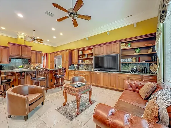 a bedroom with a bed and a flat tv screen on dresser