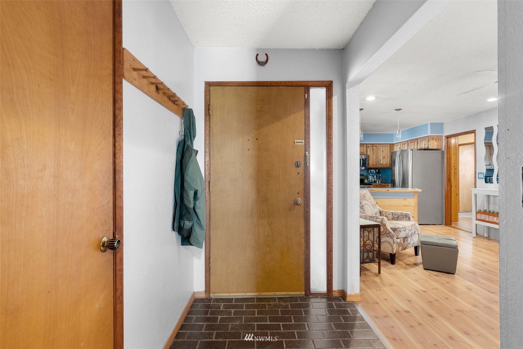 1652 Bishop Road Chehalis, WA 98532 - Photo 6 of 31 a view of a hallway with bathroom and wooden floor