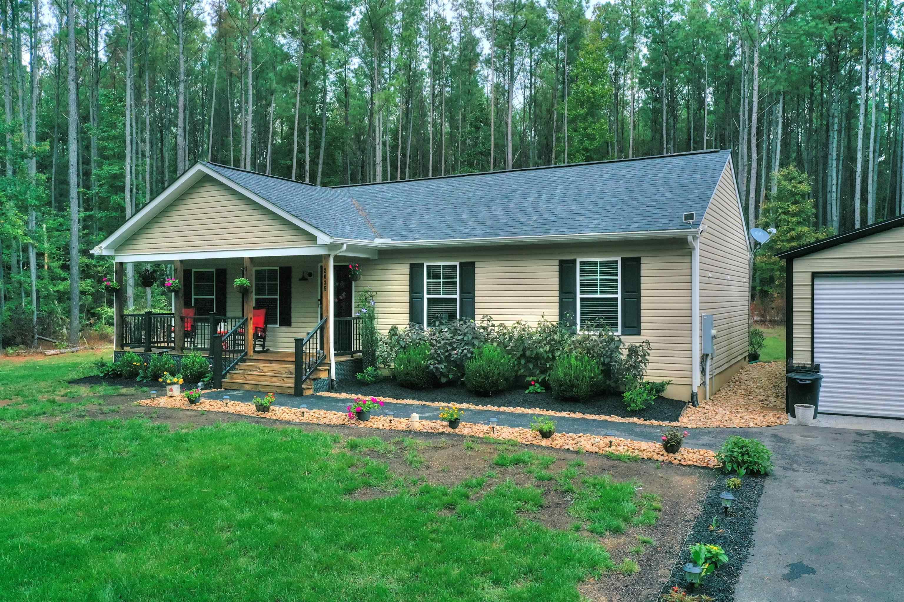 2635 Bumpass Road Bumpass, VA 23024 - Photo 14 of 38 a view of a house with backyard sitting area and garden