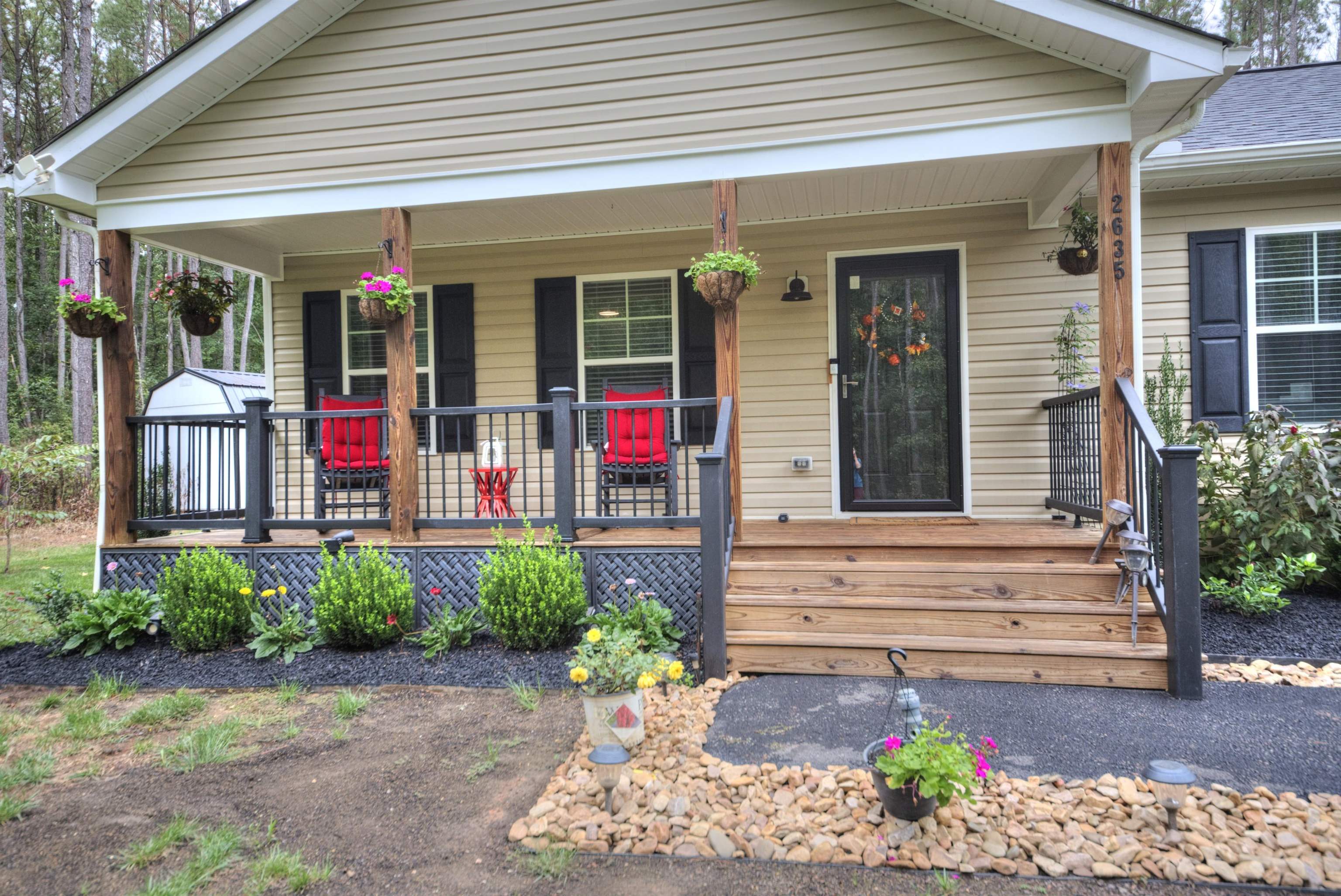 2635 Bumpass Road Bumpass, VA 23024 - Photo 2 of 38 a view of a house that has a flower garden