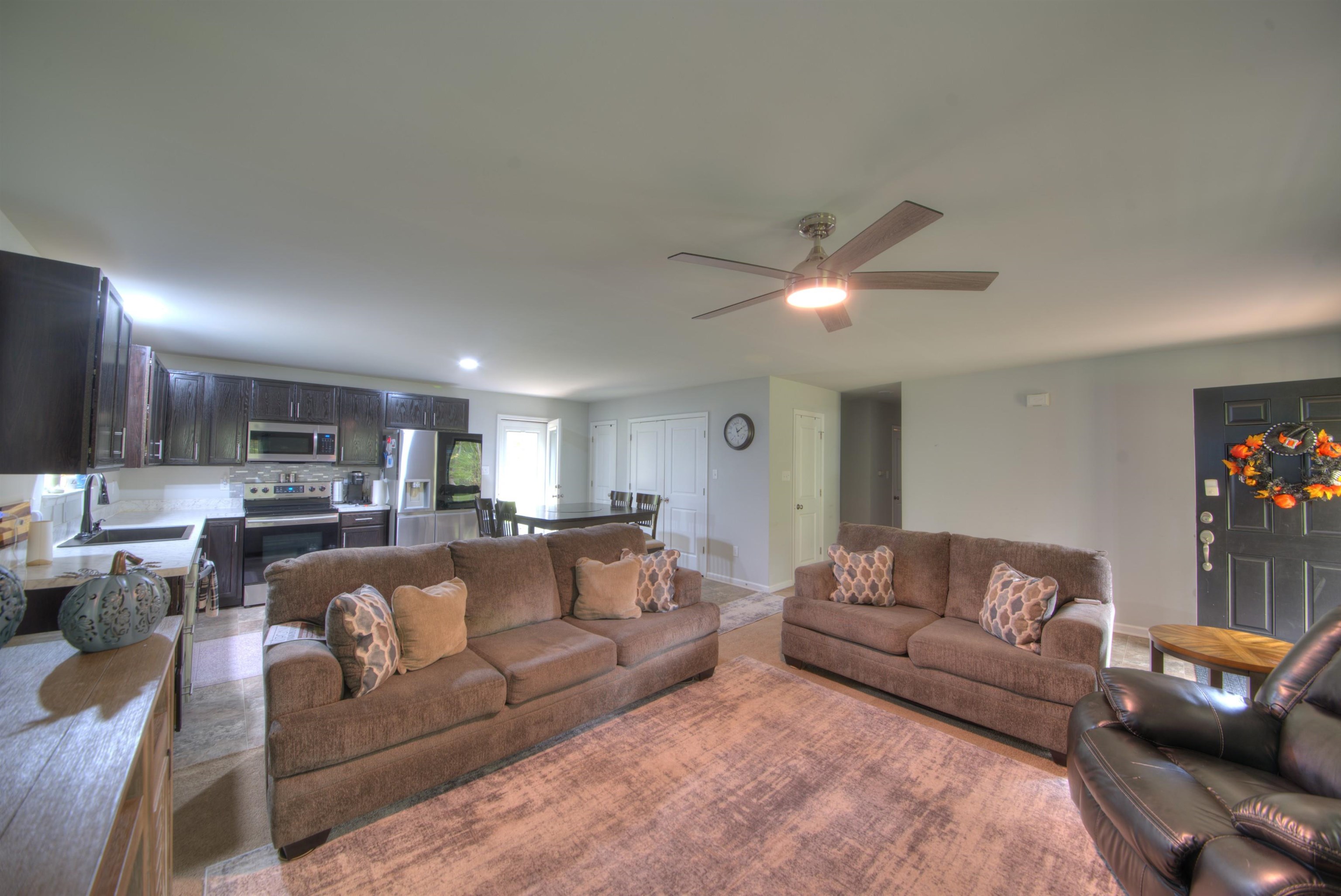 2635 Bumpass Road Bumpass, VA 23024 - Photo 24 of 38 a living room with furniture and a ceiling fan