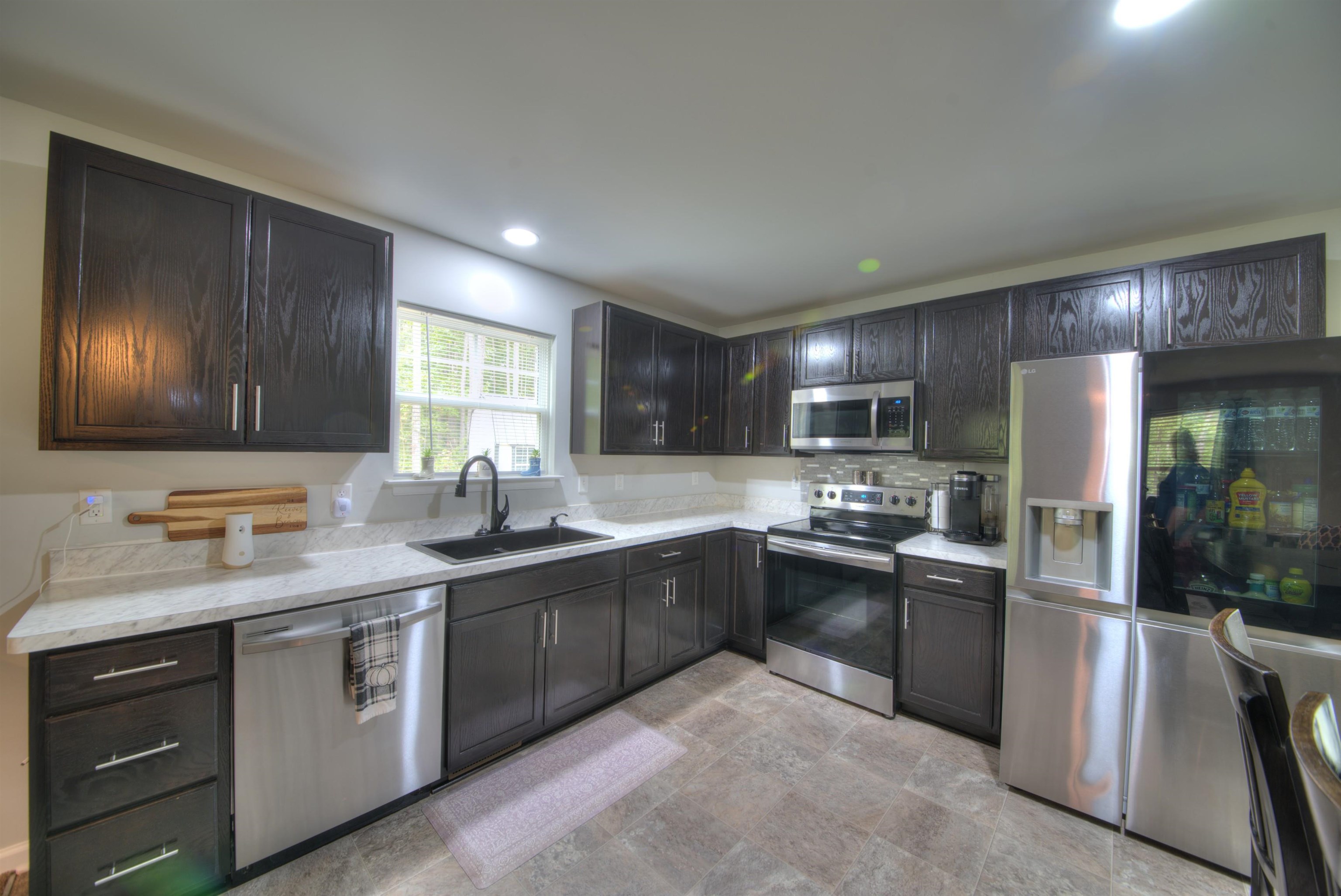 2635 Bumpass Road Bumpass, VA 23024 - Photo 25 of 38 a kitchen with lots of counter top space sink and stainless steel appliances