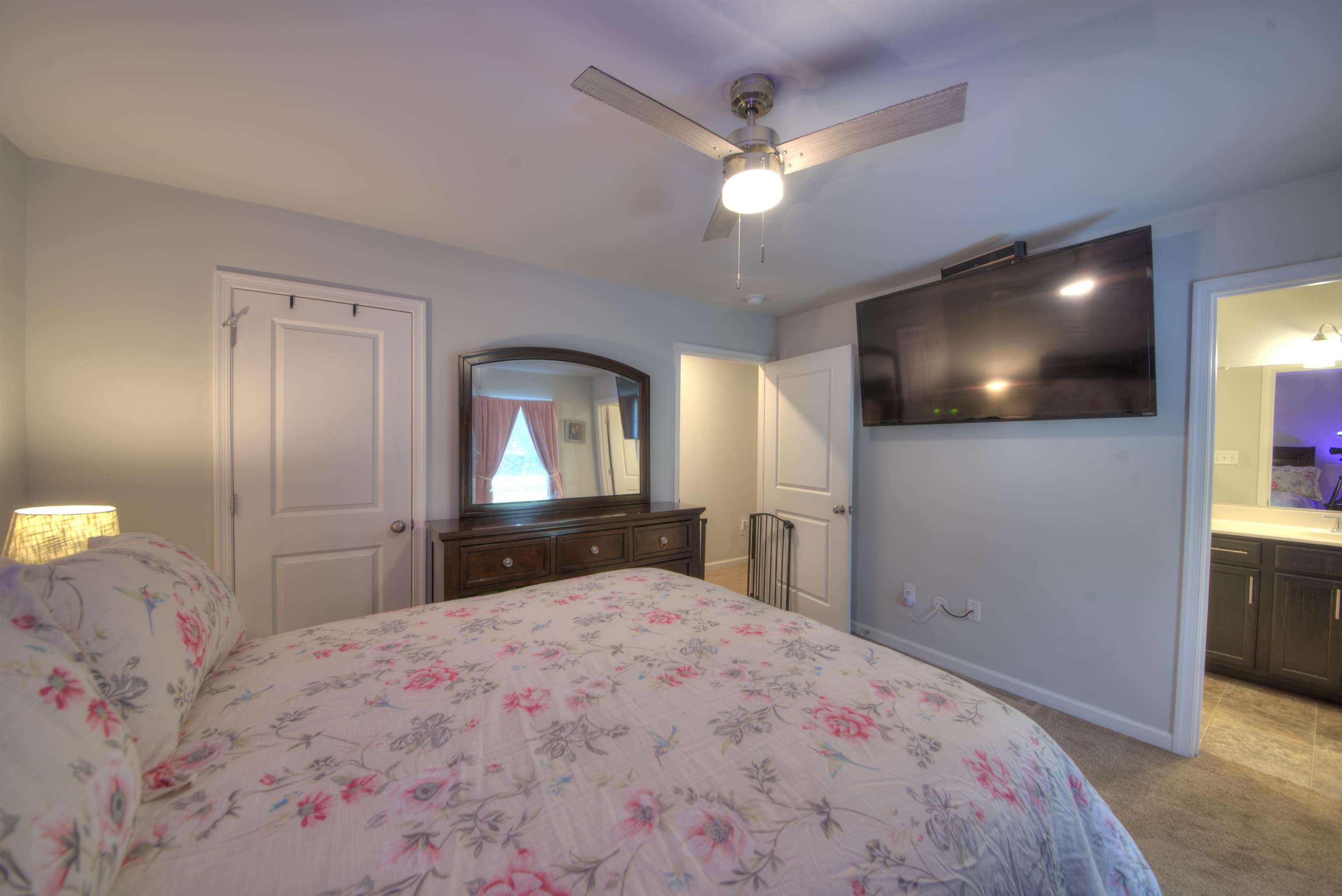 2635 Bumpass Road Bumpass, VA 23024 - Photo 29 of 38 a bedroom with a bed and a flat screen tv
