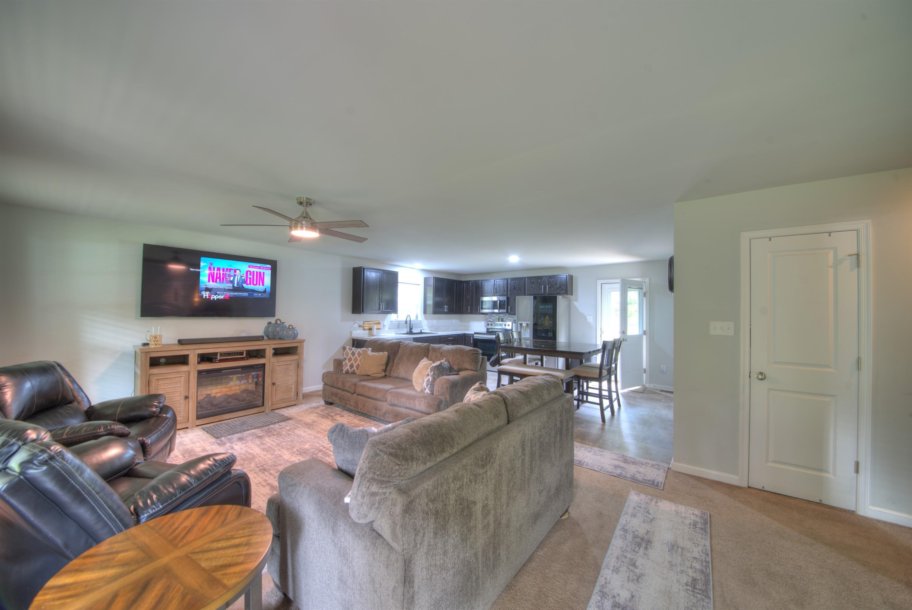 2635 Bumpass Road Bumpass, VA 23024 - Photo 3 of 38 a living room with furniture and a flat screen tv