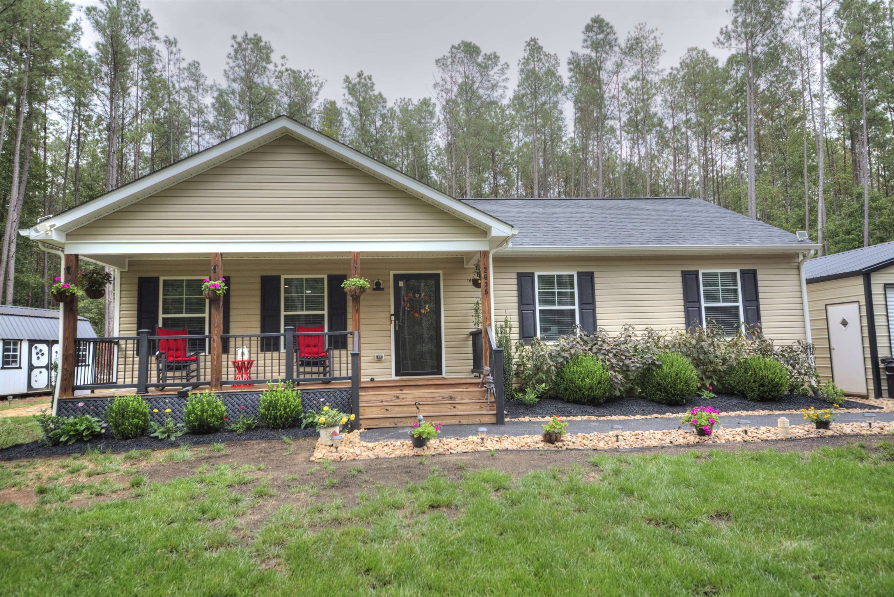 2635 Bumpass Road Bumpass, VA 23024 - Photo 36 of 38 a front view of a house with a yard and outdoor seating