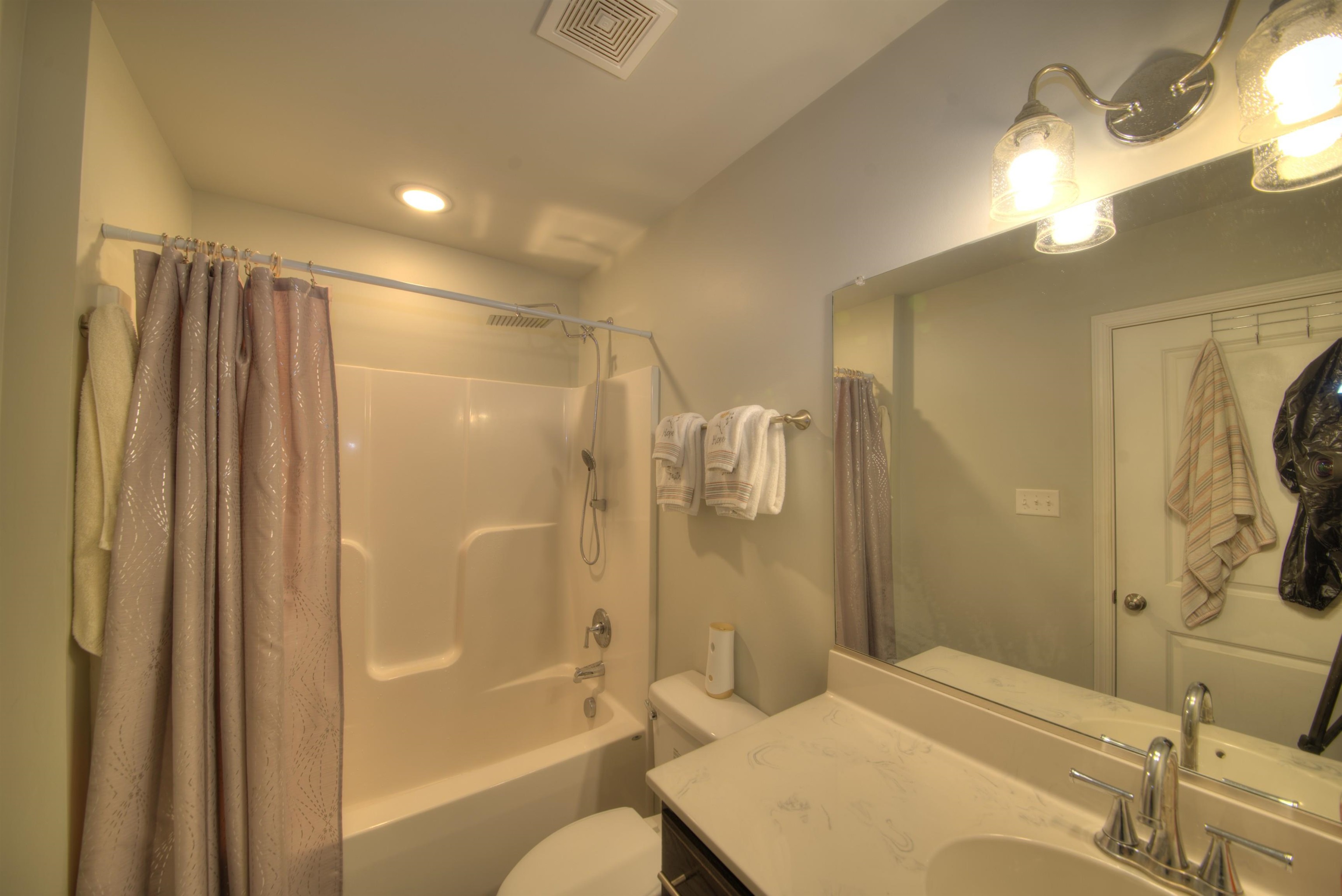 2635 Bumpass Road Bumpass, VA 23024 - Photo 7 of 38 a bathroom with a bathtub shower sink vanity and toilet