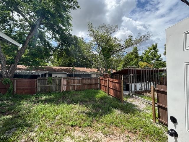 2326 Clifford Street Fort Myers, FL 33901 - Photo 16 of 21 a view of a house with wooden fence