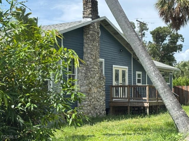 2326 Clifford Street Fort Myers, FL 33901 - Photo 3 of 21 a backyard of a house with lots of green space