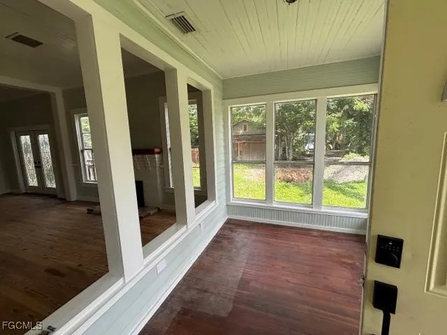 a view of outdoor space and wooden floor