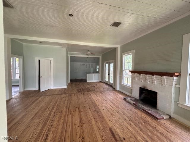 2326 Clifford Street Fort Myers, FL 33901 - Photo 6 of 21 a view of empty room with wooden floor and fireplace