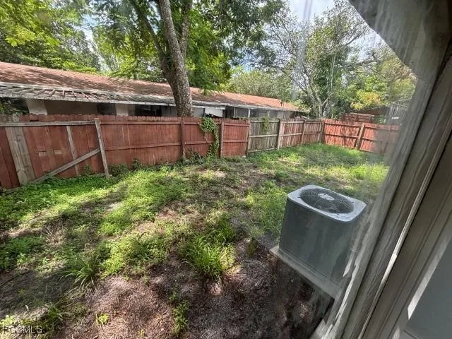 a view of a backyard with pathway
