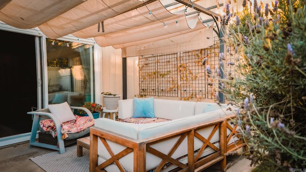1761 Greentree Road Encinitas, CA 92024 - Photo 15 of 20 a dining room with furniture and a floor to ceiling window