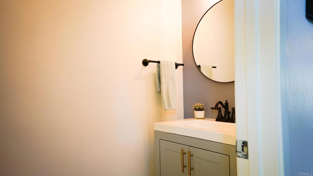 1761 Greentree Road Encinitas, CA 92024 - Photo 6 of 20 a bathroom with a sink and mirror