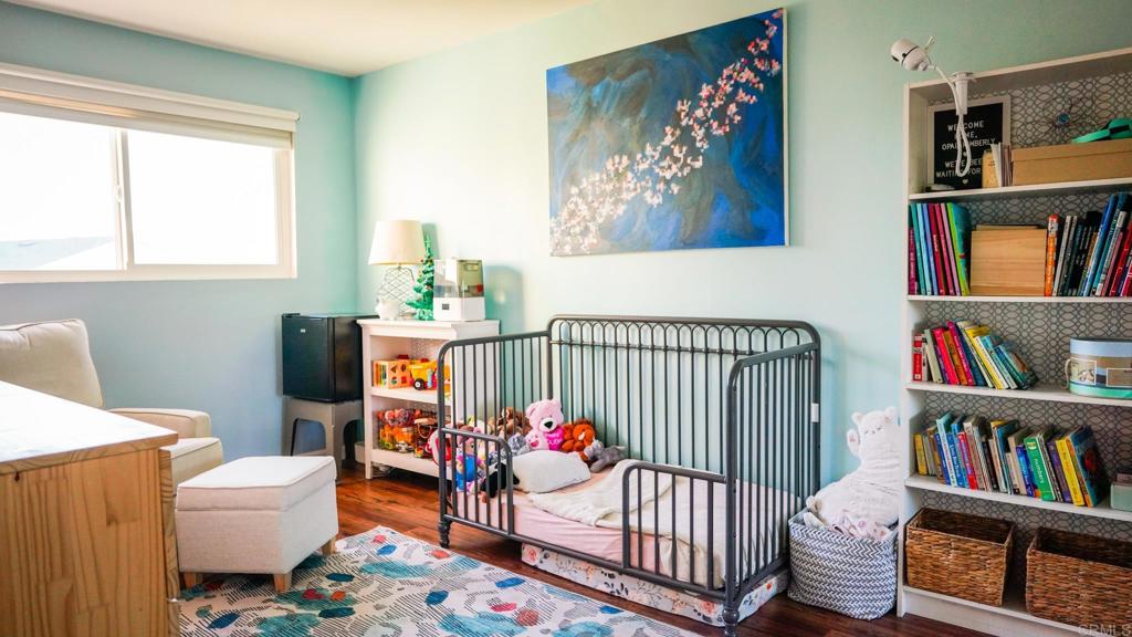 1761 Greentree Road Encinitas, CA 92024 - Photo 9 of 20 a bedroom with furniture and book shelf