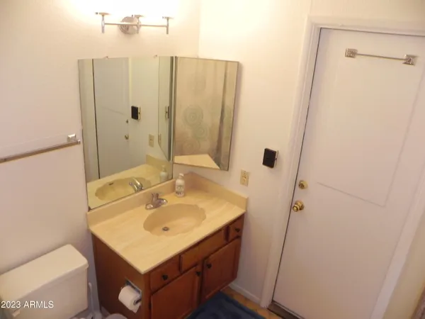 a bathroom with a sink a mirror and shower