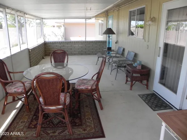 a dining room with furniture and window