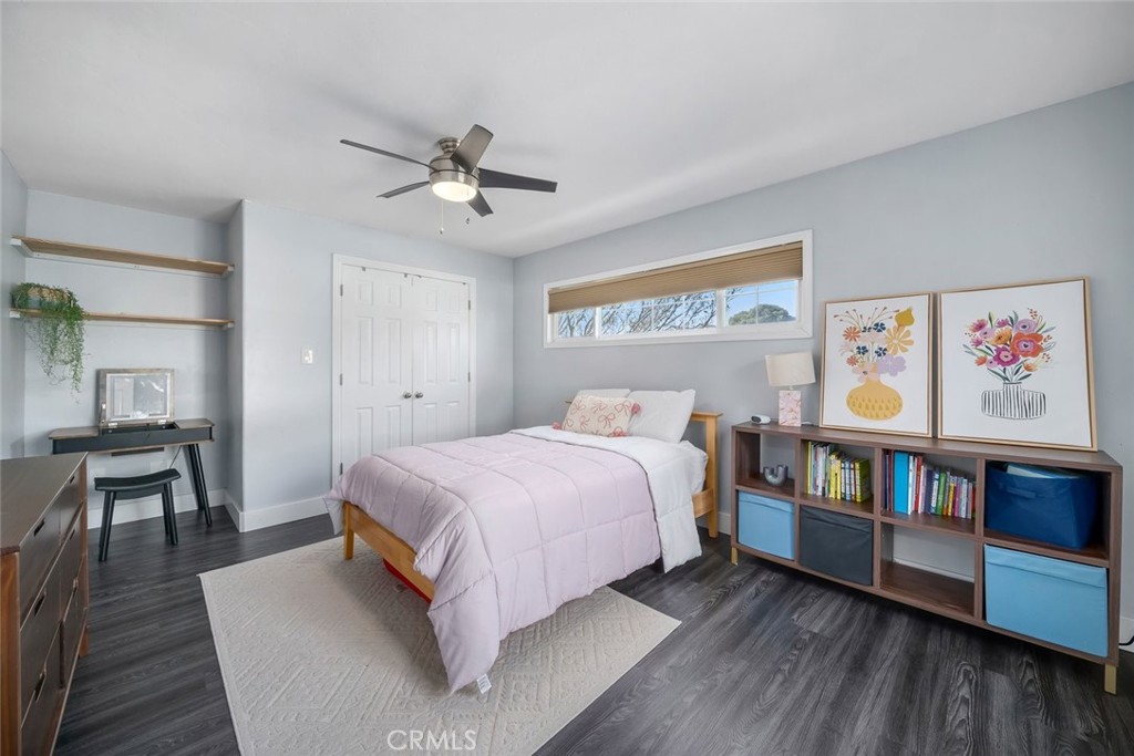 403 Beech Street Arroyo Grande, CA 93420 - Photo 19 of 46 a bedroom with a bed and a book shelf