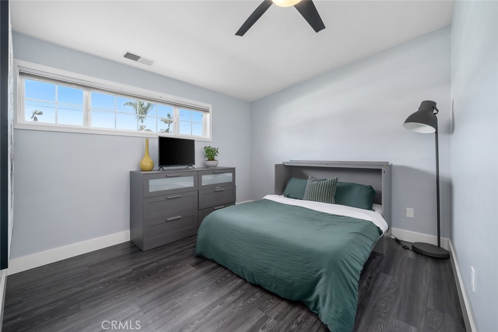 403 Beech Street Arroyo Grande, CA 93420 - Photo 22 of 46 a bedroom with a bed and a tv on the dresser