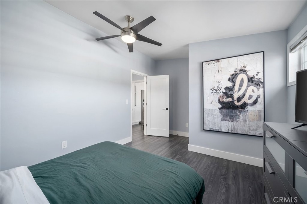 403 Beech Street Arroyo Grande, CA 93420 - Photo 23 of 46 a bedroom with a bed and a painting on the wall