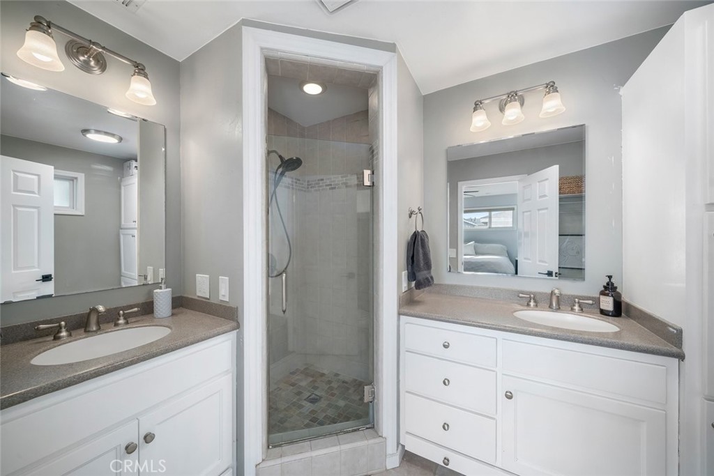 403 Beech Street Arroyo Grande, CA 93420 - Photo 29 of 46 a bathroom with a granite countertop sink mirror and double