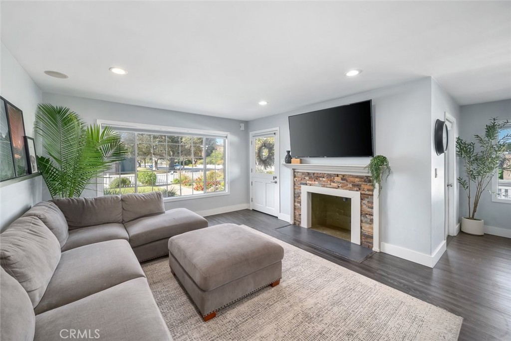 403 Beech Street Arroyo Grande, CA 93420 - Photo 6 of 46 a living room with furniture a fireplace and a flat screen tv